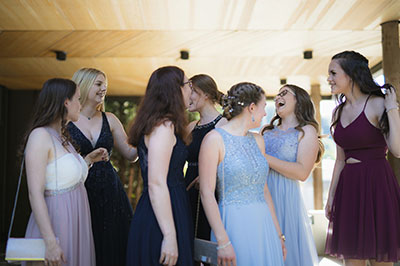 ladies hugging and touching each other